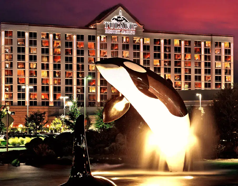 Luck meets luxury - Tulalip Orca water feature with hotel in the background