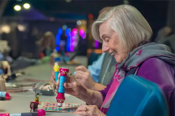 Woman daubing a Bingo card
